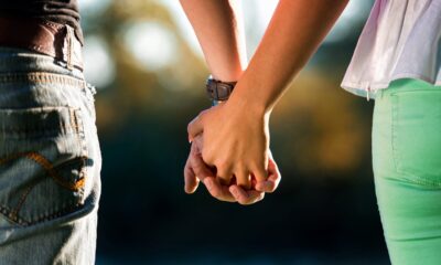 A couple holding hands scaled 1