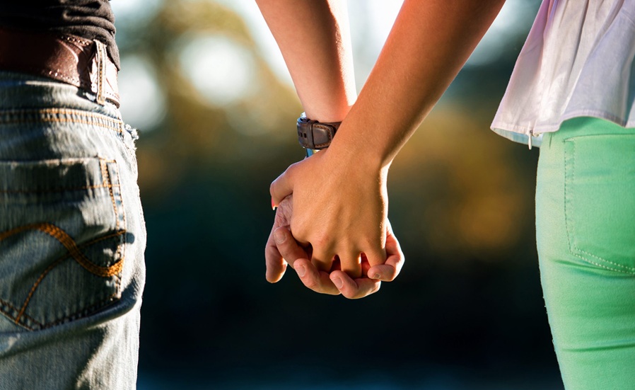 A couple holding hands scaled 1