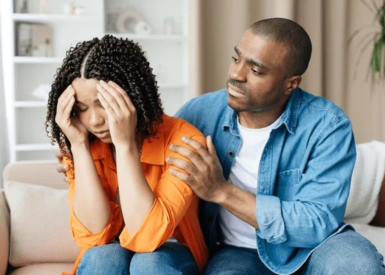 compassionate black man comforting