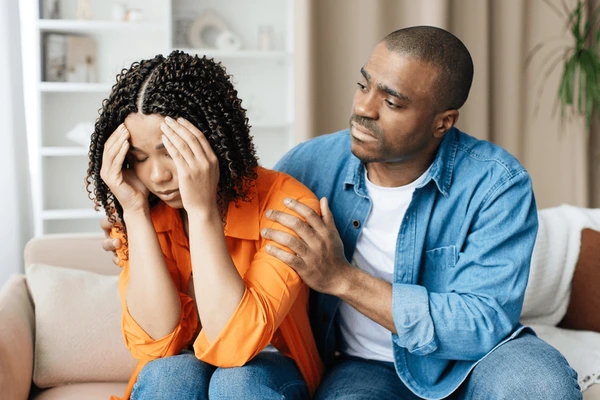compassionate black man comforting